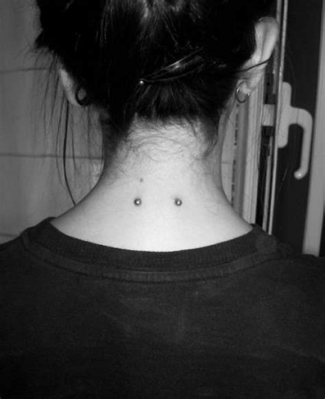 nape piercing under hairline.